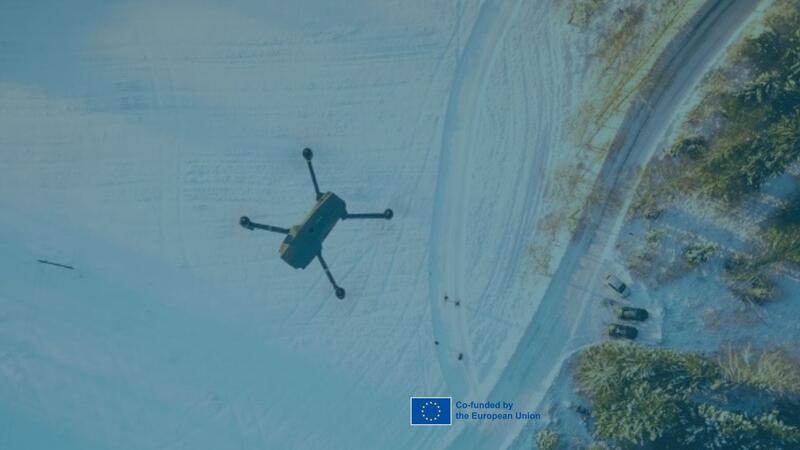 drone flying above winter landscape