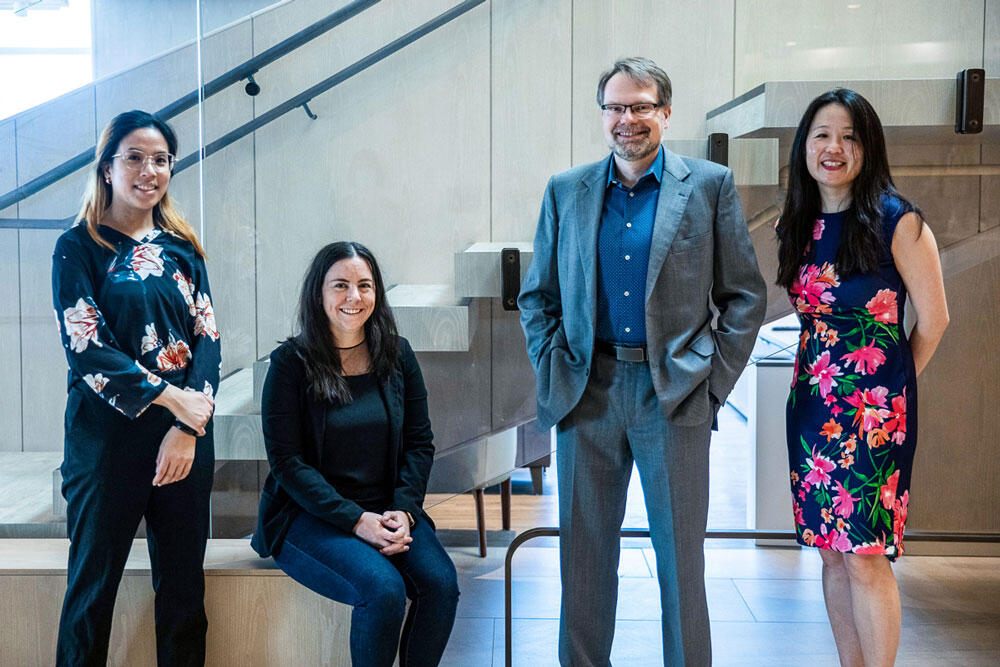 Picture showing four people: Chloe Pou-Prom, data scientist; Ashley Jones, project manager; Dr. James Marriott, neurologist; and Dr. Jiwon Oh, medical director of the BARLO MS Centre are members of the team at Unity health.